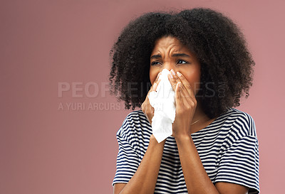 Buy stock photo Stress, tissue and sick woman in studio blowing nose for allergies, flu or covid emergency on pink background. Congestion, paper and face of gen z model with bacteria risk, bug or influenza disaster