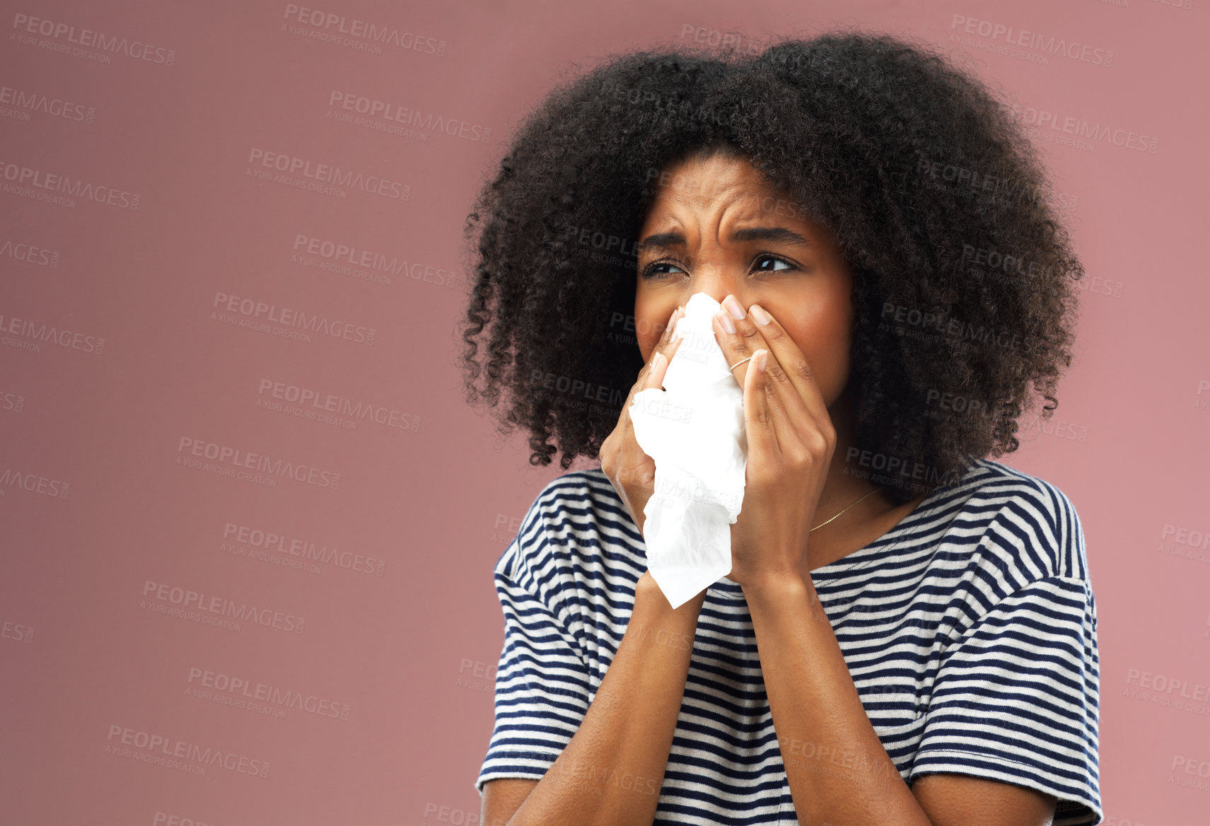 Buy stock photo Stress, tissue and sick woman in studio blowing nose for allergies, flu or covid emergency on pink background. Congestion, paper and face of gen z model with bacteria risk, bug or influenza disaster