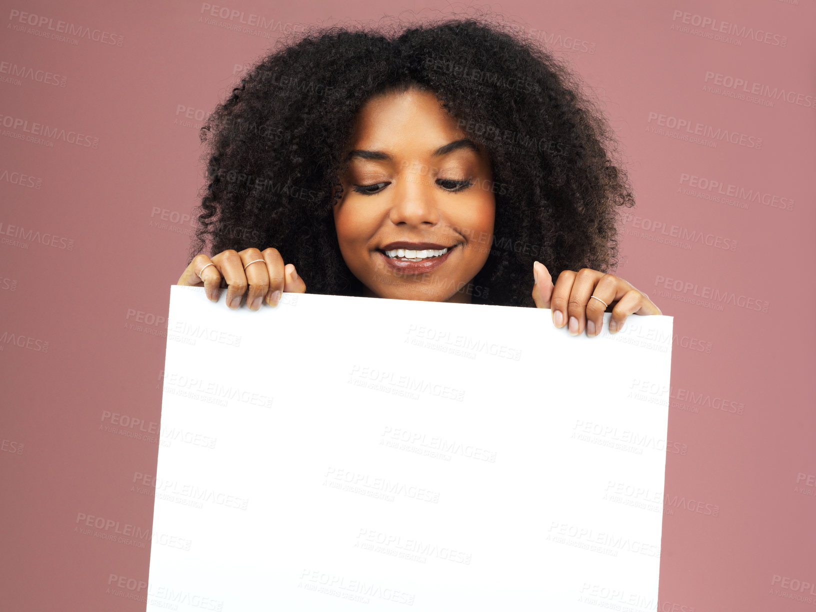 Buy stock photo Advertising, mockup and placard with black woman in studio with branding isolated on pink background. Logo, marketing and paper poster or sale announcement sign for commercial with message in Spain. 