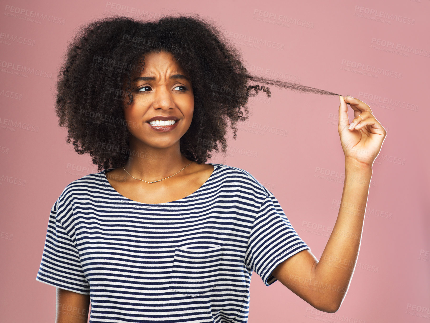 Buy stock photo Pulling hair, woman and stress with dermatology, beauty and person on pink studio background. African person, model and girl with aesthetic, texture and cosmetics with shampoo, angry and frustrated