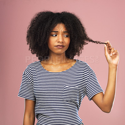 Buy stock photo Pulling hair, woman and stress with dermatology, frustrated or person on pink studio background. African person, model or girl with aesthetic, texture or transformation with shampoo, results or angry