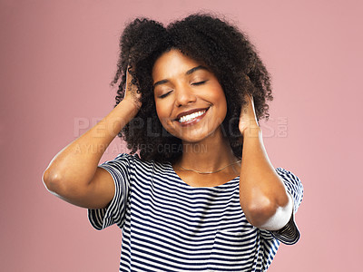 Buy stock photo Studio shot of a beautiful young woman posing with her hands in her hair