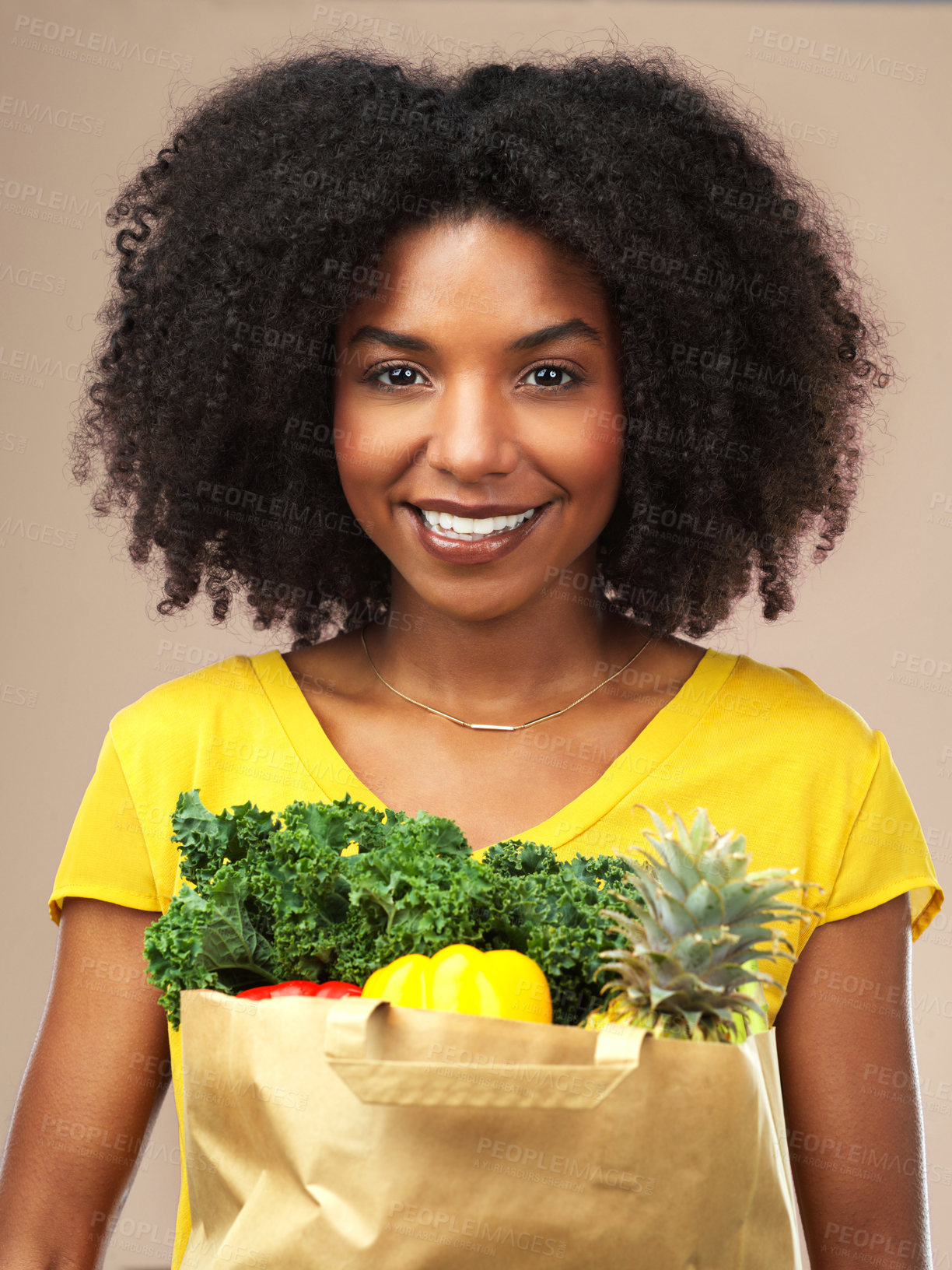 Buy stock photo Black woman, portrait and vegan grocery of vegetables or fruit in studio background smiling for eating healthy. Female person, happy and wellness food in bag for organic shopping and nutrition