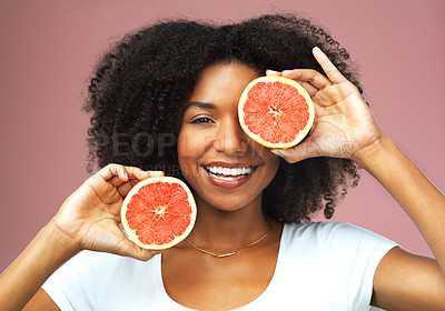 Buy stock photo Grapefruit, smile and face portrait of black woman in studio isolated on a pink background. Natural, fruit and African female model with vegan nutrition, vitamin c or healthy diet, food or wellness.