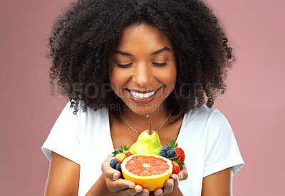 Buy stock photo Happy, woman and fruit in hands for health, balanced diet and nutrition with vitamin c and wellness. Excited, female person and food for detox, vegan choice or low carb option for weight loss