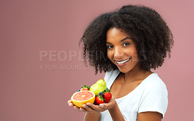 Buy stock photo Health, woman and fruit in hand for balanced diet and nutrition with vitamin c and mockup in studio. Smile, female person and organic produce for detox, vegan option and weight loss for wellness