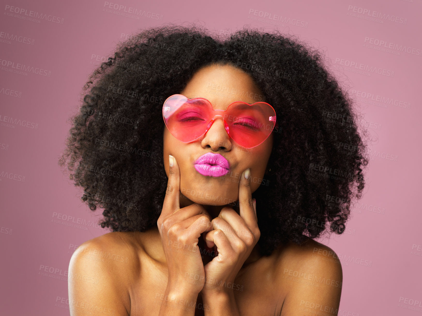 Buy stock photo Studio, kiss and black girl with sunglasses, makeup and confident with cosmetics for face and shades. Fashion, African woman or person with lipstick, pouting or eyewear with heart on pink background