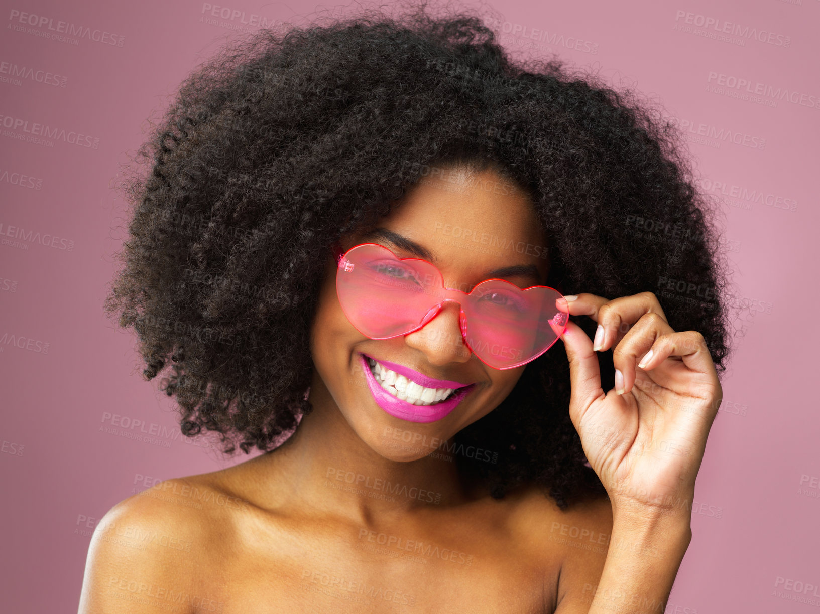 Buy stock photo Woman, portrait and face of curly hair, sunglasses and skincare for playful person isolated on color background. Smile, dermatology and fashion for beauty with female model in studio for haircare