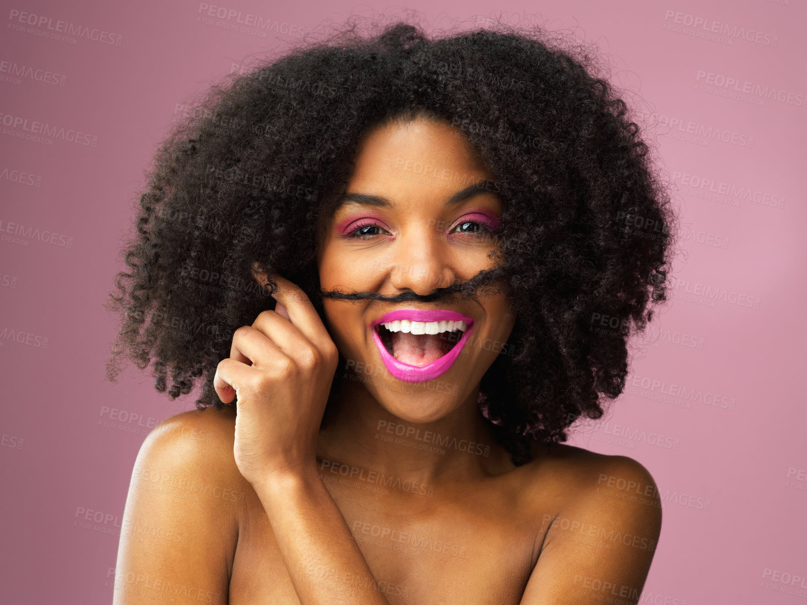 Buy stock photo Studio shot of an attractive young woman posing against a pink background