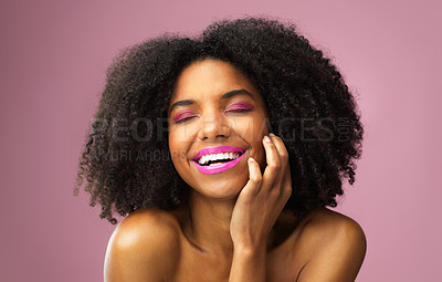 Buy stock photo Studio shot of an attractive young woman posing against a pink background