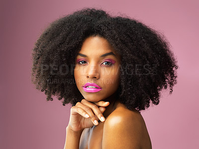 Buy stock photo Studio shot of an attractive young woman posing against a pink background