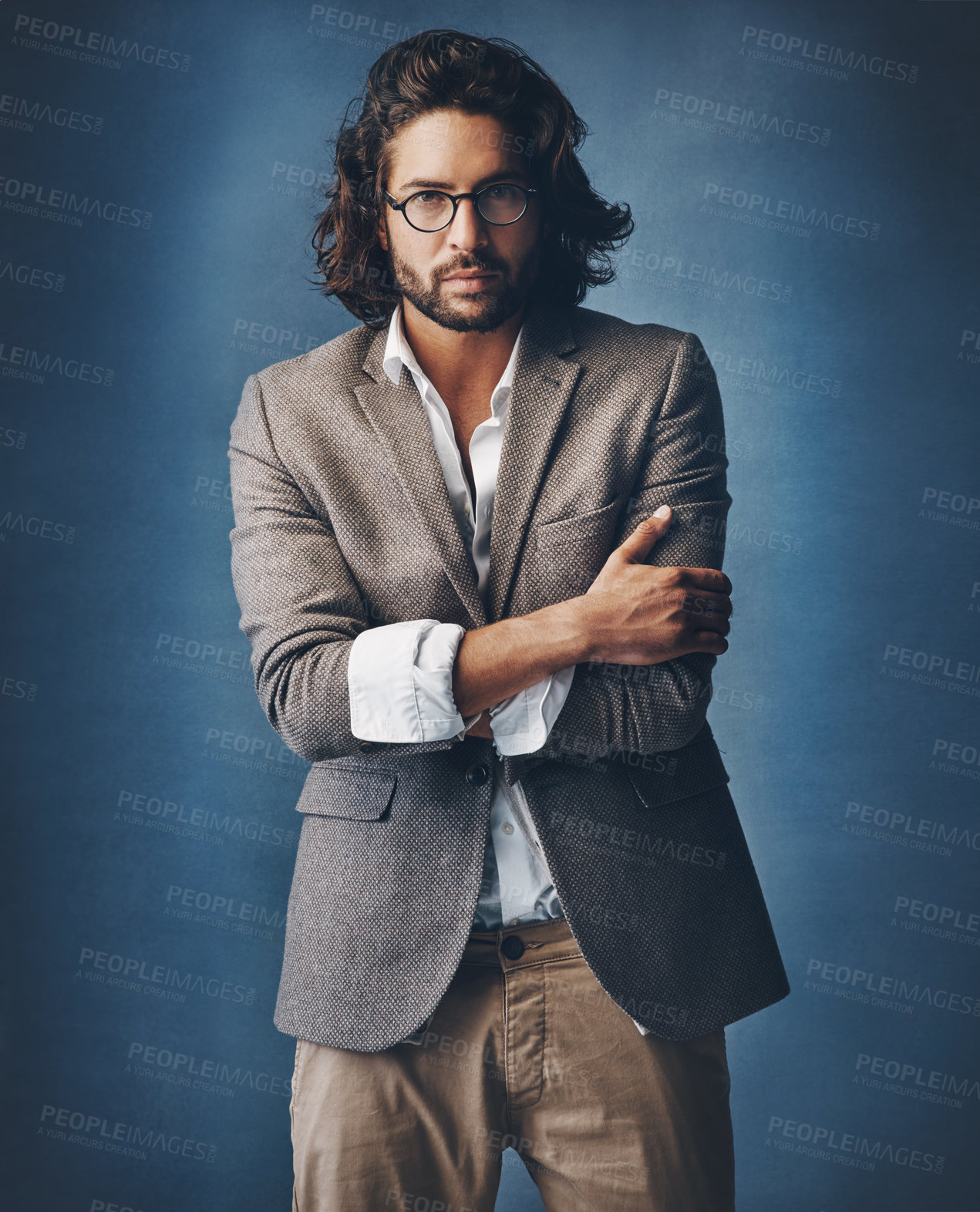 Buy stock photo Businessman, portrait and confident in studio for fashion or corporate career with executive look for manager roll or supervisor. Man, trendy and stylish arms crossed, serious and dark background.