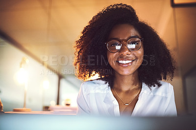 Buy stock photo Portrait of a young businesswoman working in an office at night