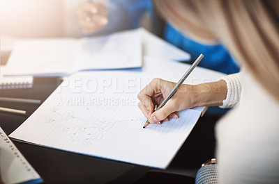Buy stock photo Closeup shot of a university student writing notes in her book