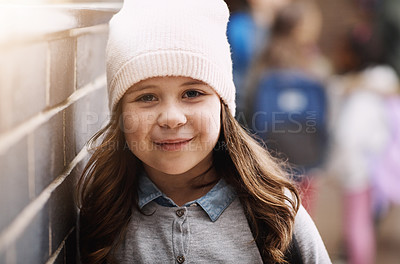 Buy stock photo Cropped portrait of an elementary school girl standing in the corridor at school