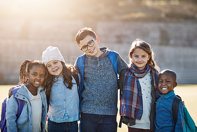 Buy stock photo Cropped portrait of a group of elementary school kids standing together outside