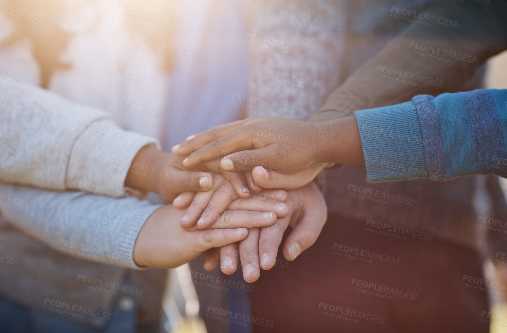 Buy stock photo Kids, hands and outdoor stack at school, students and motivation for learning development. Children, pile and group of friends together for knowledge, education and pupils for class celebration