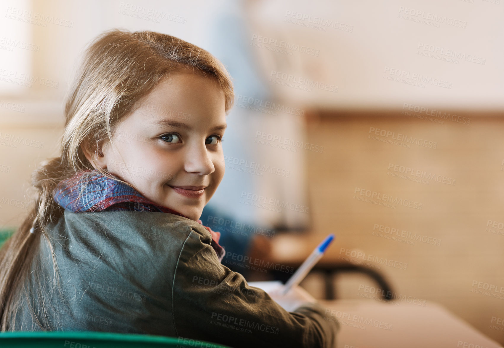Buy stock photo Rearview portrait of an elementary school girl sitting in the classroom