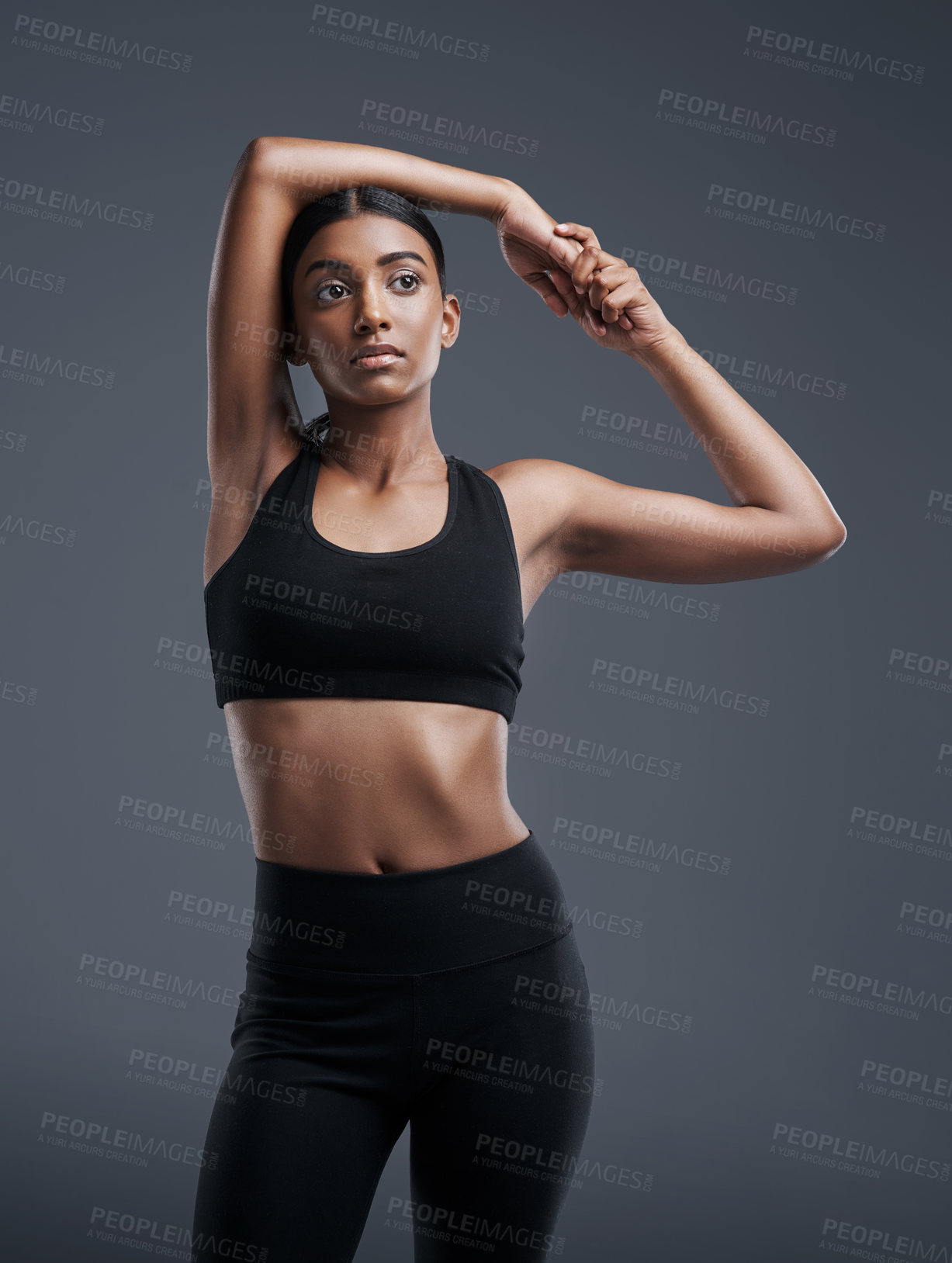 Buy stock photo Idea, mockup and stretching with an athlete woman in studio on a gray background for fitness or health. Exercise, thinking and warm up with an attractive young female model training her body