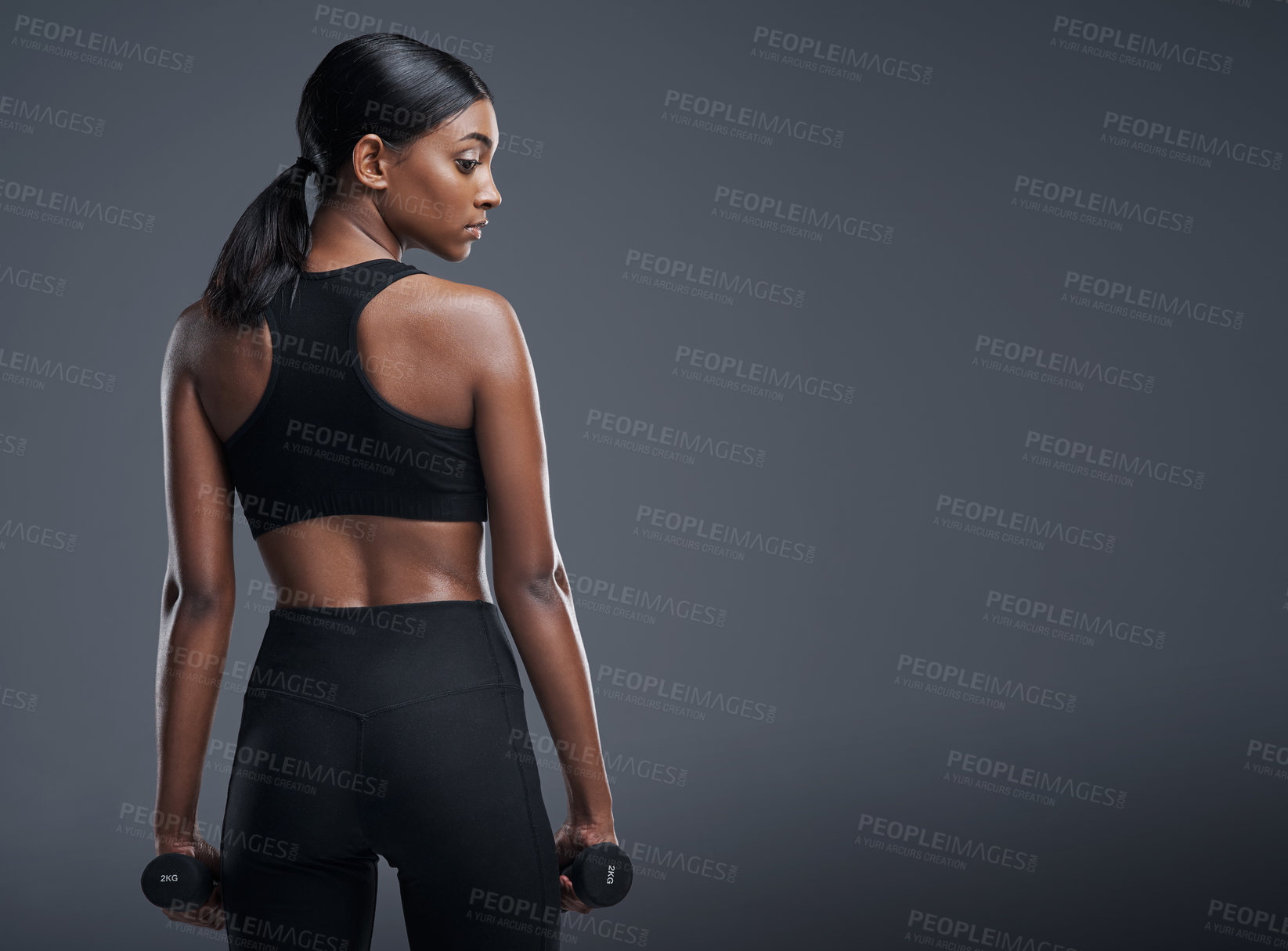 Buy stock photo Fitness, sports and woman with dumbbell in studio for workout, muscle exercise and healthy body. Mockup, person and back of athlete with for cardio, pride and strength training on gray background