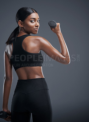Buy stock photo Indian woman, dumbbells and workout or exercise in studio on grey background for health, muscles and fitness. Back view, sportswear and committed for wellbeing with weights for training and self care