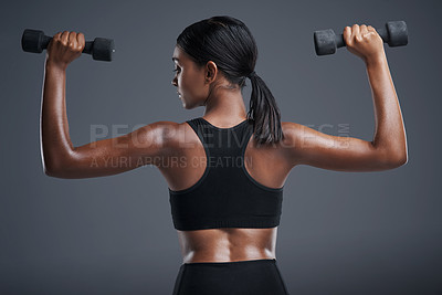 Buy stock photo Fitness, training and woman with dumbbells, studio and gym for workout, sport and wellness in mockup. Background, sportswear and goals for body, exercise and healthy with club, athlete and girl