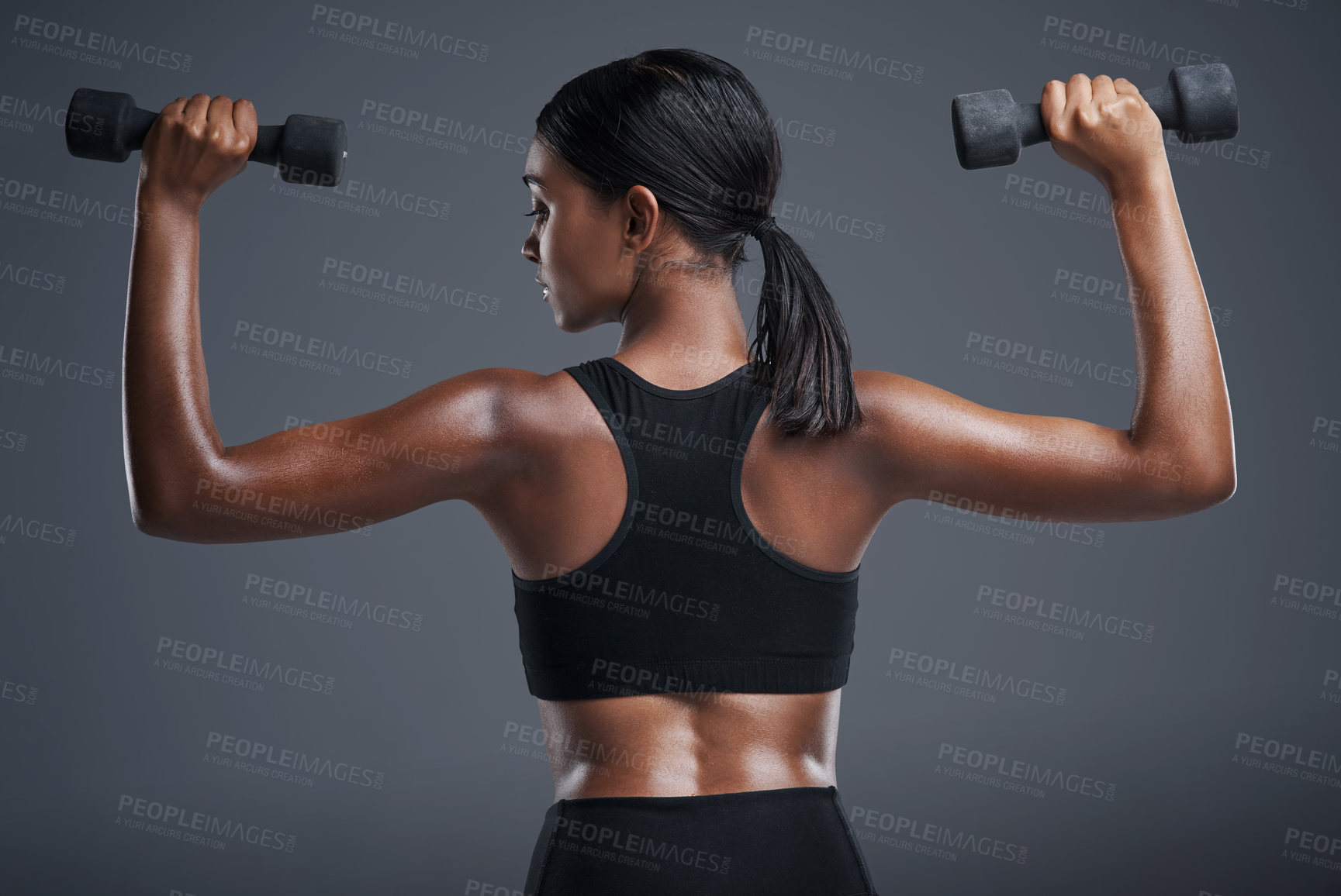 Buy stock photo Fitness, training and woman with dumbbells, studio and gym for workout, sport and wellness in mockup. Background, sportswear and goals for body, exercise and healthy with club, athlete and girl