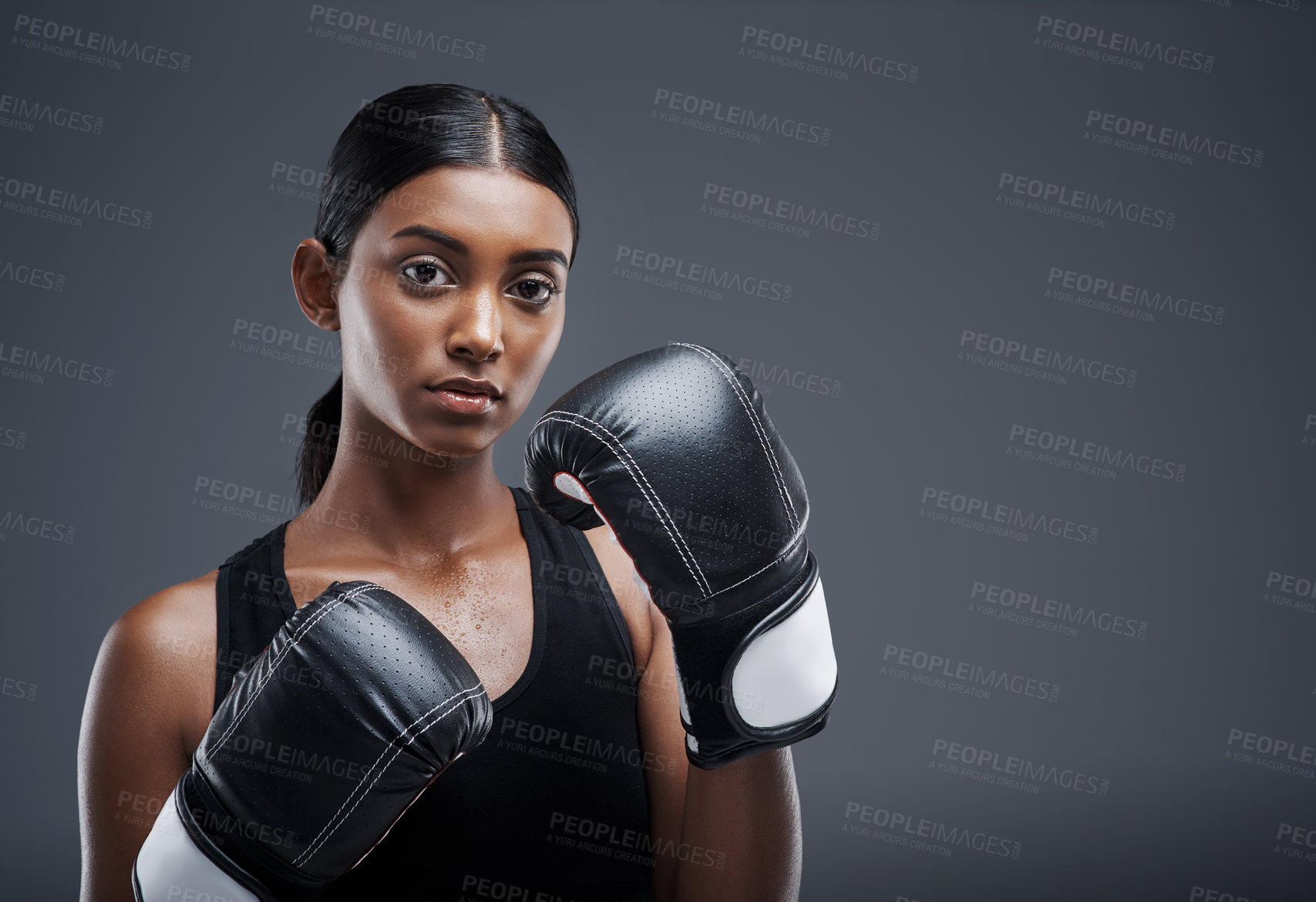 Buy stock photo Portrait, boxing gloves and Indian woman in studio for sports, combat and training for fitness. Self defence, boxer or mma fighter for performance, workout and muay thai and cardio or impact exercise