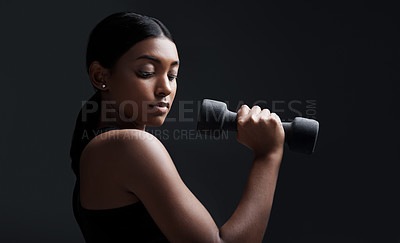 Buy stock photo Indian woman, dumbbells and exercise in studio for training on black background, lose weight or mockup. Female person, weightlifting and gym fitness workout or bicep muscle, wellness or challenge