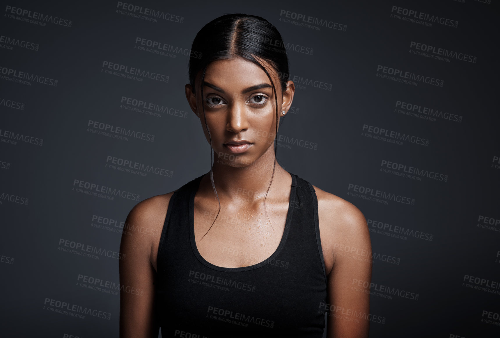 Buy stock photo Portrait, serious and Indian woman with fitness, exercise and confident girl against a dark studio background. Face, female person and athlete with determination, endurance and workout for wellness