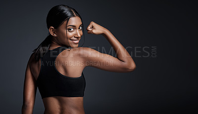 Buy stock photo Portrait, smile and woman flexing back in studio isolated on a black background mockup. Strong flex, happy and Indian female athlete with bicep, arm strength or bodybuilder muscle, fitness or workout