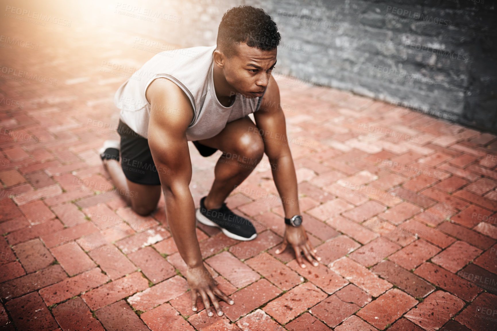Buy stock photo Runner, start and black man ready for race, cardio workout or running competition in city. Fitness, lens flare and athlete person in outdoor for sprint exercise, marathon training or speed challenge