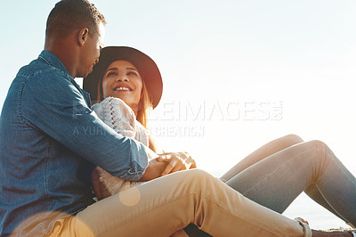 Buy stock photo Shot of a happy young couple enjoying a romantic day outdoors