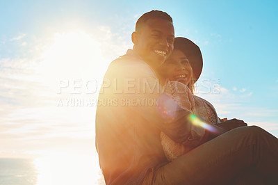 Buy stock photo Shot of a happy young couple enjoying a romantic day outdoors