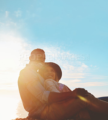 Buy stock photo Shot of a happy young couple enjoying a romantic day outdoors