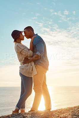 Buy stock photo Shot of a happy young couple sharing a romantic moment outdoors