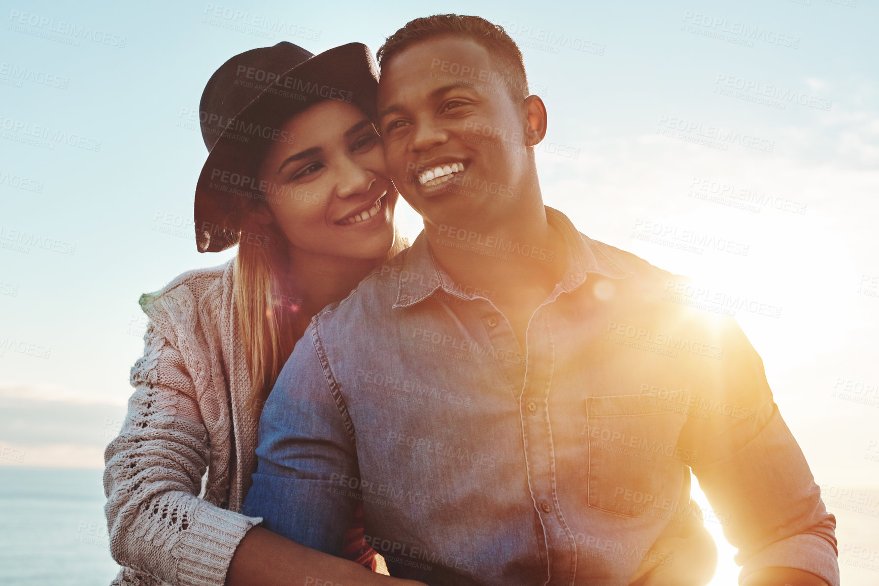 Buy stock photo Shot of a happy young couple enjoying a romantic day outdoors