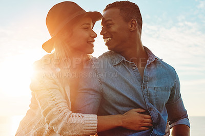 Buy stock photo Shot of a happy young couple enjoying a romantic day outdoors