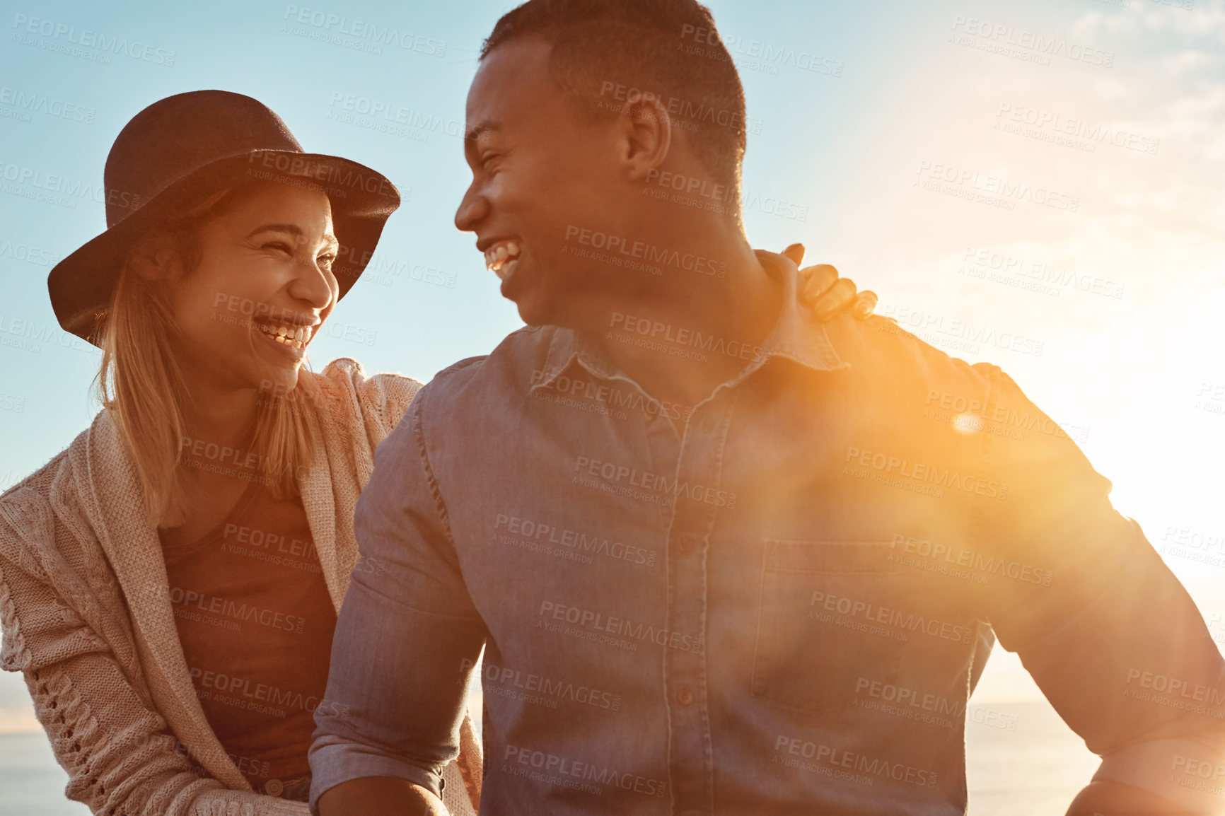 Buy stock photo Shot of a happy young couple enjoying a romantic day outdoors