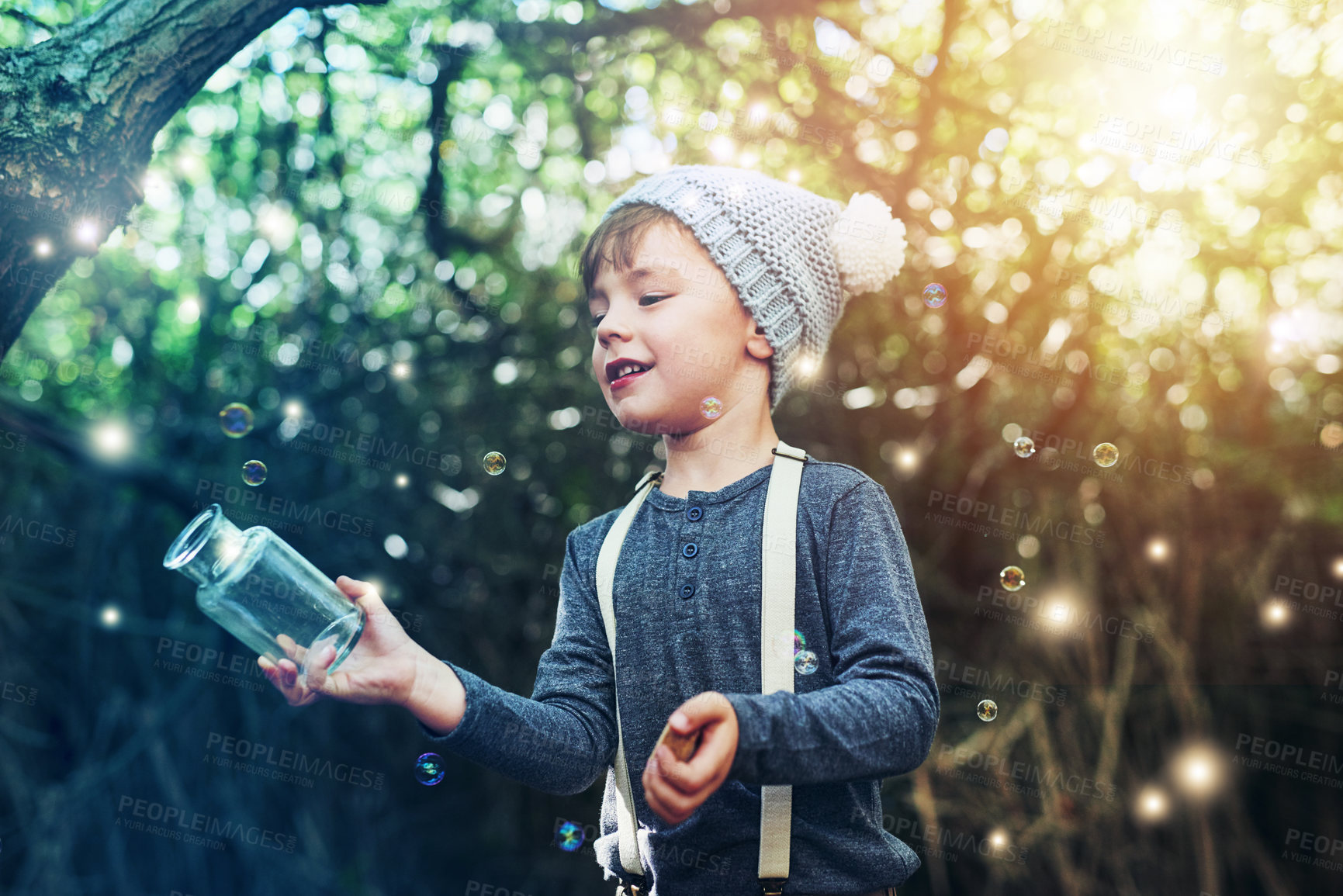 Buy stock photo Magic, jar and light outdoor in nature with glow, shine and young child playing in forest. Boy, smile and happy in woods as dream with fantasy for unique mystical fairy, bubble and folklore at night