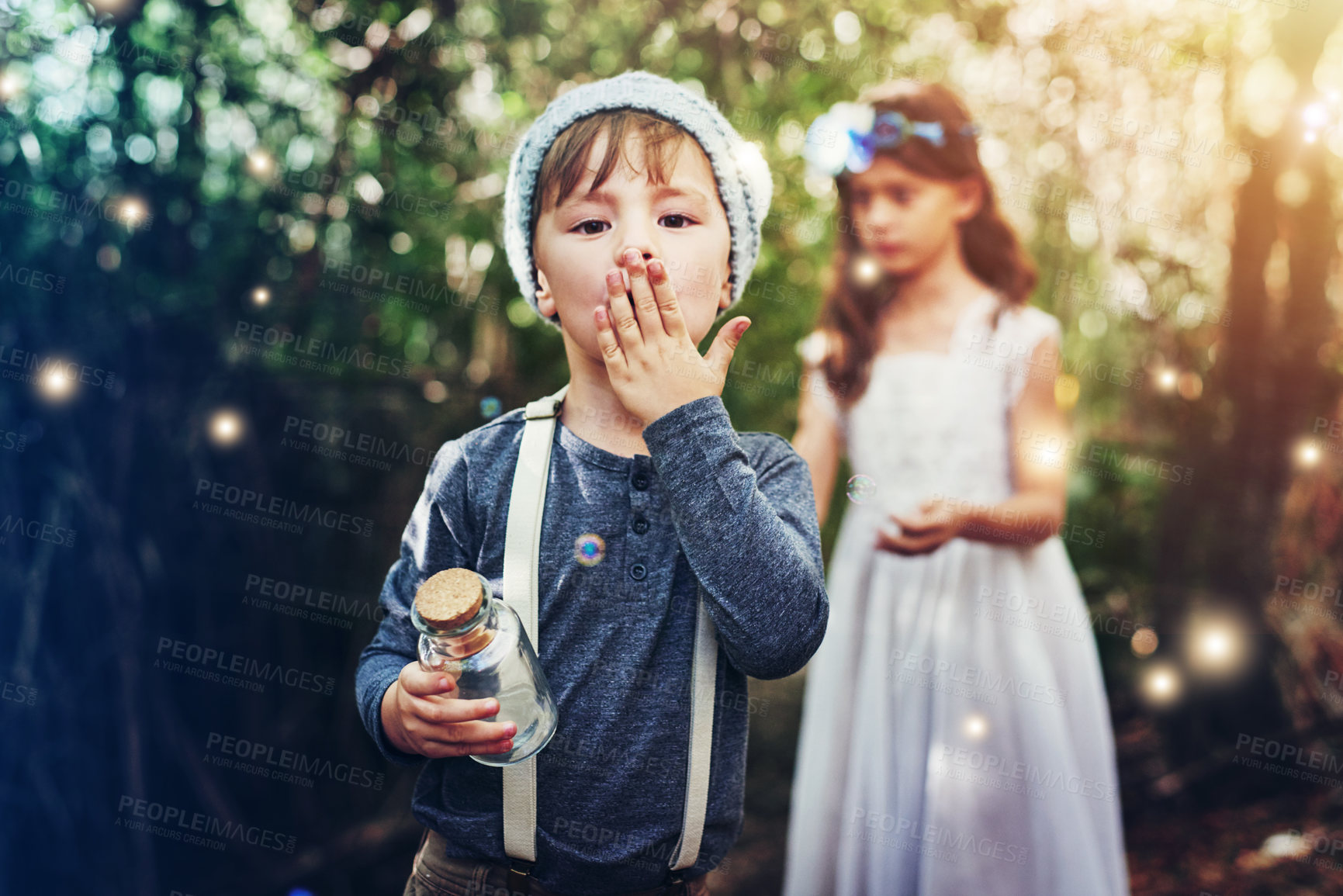 Buy stock photo Portrait of two little siblings catching fireflies in jars outside