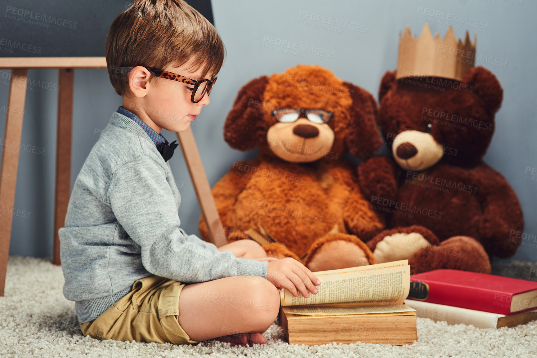 Buy stock photo Teddy bear, reading and child with book in home for story time, development and learning. Education, intelligent and young boy with toys, literature and novel for fantasy, storytelling and fairytale