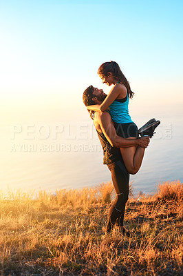 Buy stock photo Full length shot of an affectionate couple hugging while out for a workout