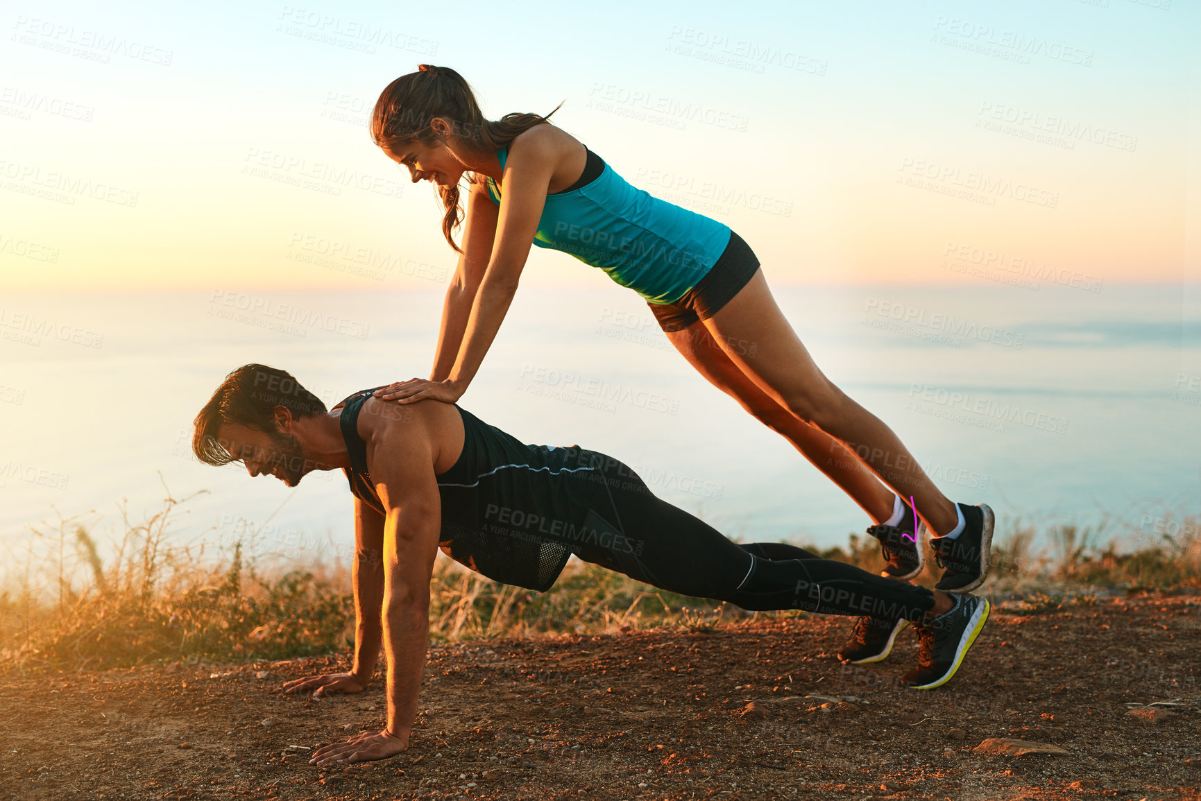 Buy stock photo Outdoor, fitness and couple with push ups for workout, balance and exercise energy with endurance. Nature, strong man and woman as body weight, support and partner with physical strength for power