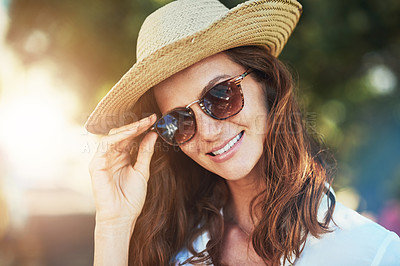 Buy stock photo Cropped portrait of an attractive young woman enjoying a summer’s day outdoors