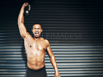 Buy stock photo Shot of a muscular young man lifting weights against a grey background