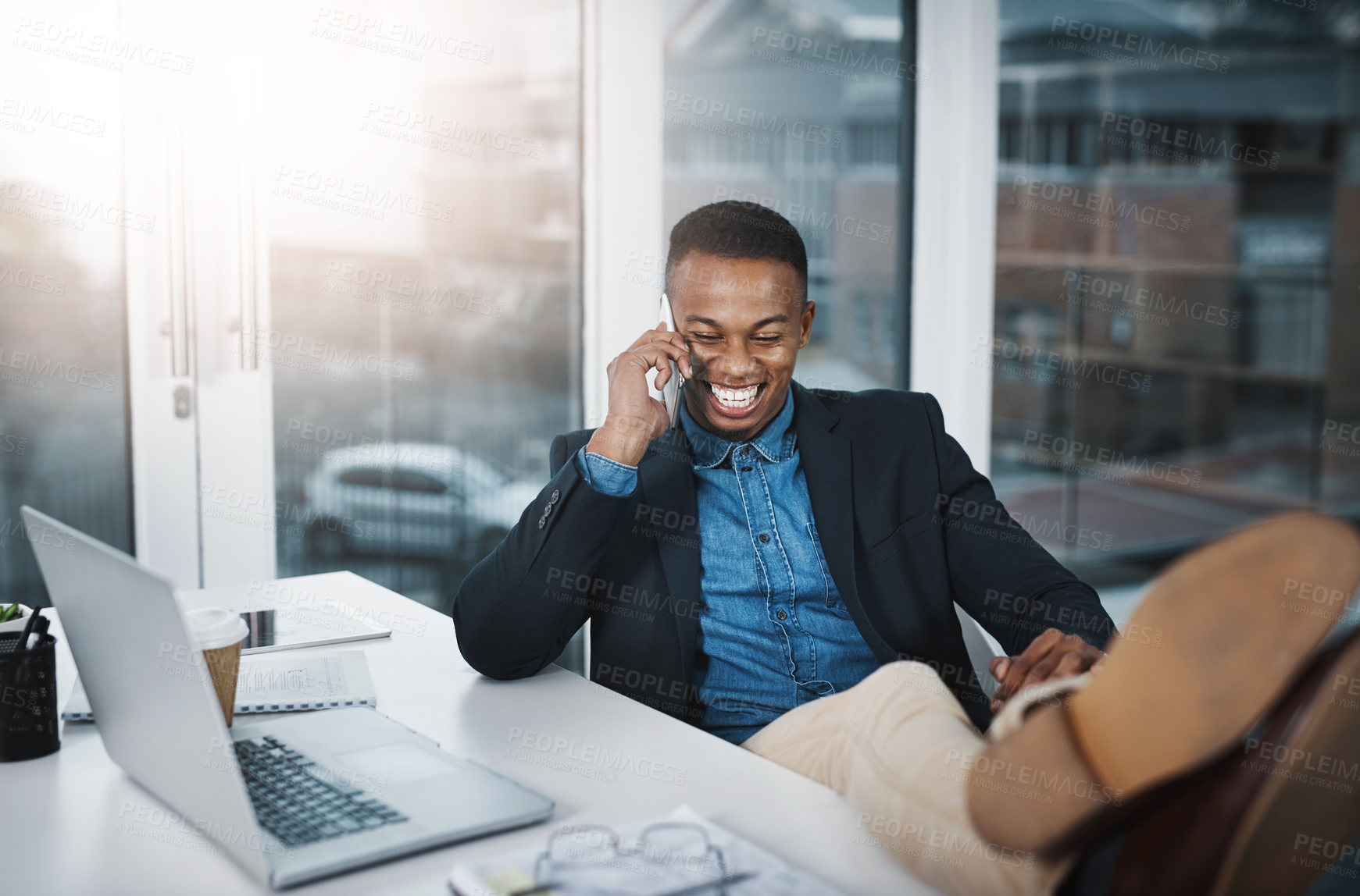 Buy stock photo Businessman, laughing and relax with phone call for funny joke, discussion or communication at office. Happy black man, accountant or employee smile with mobile smartphone for friendly conversation