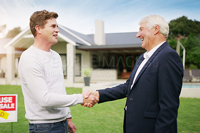 Buy stock photo Shot of a young man meeting with an estate agent at his newly purchased home