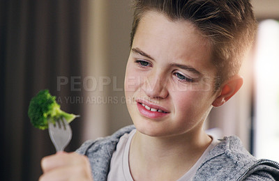 Buy stock photo Disgust, food and dislike with child and broccoli for nutrition, health and cooking. Sad, angry and dinner with boy and refuse to eat vegetable at home for eating problem, frustrated and fear