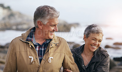 Buy stock photo Senior couple, laugh and beach walk outdoor with smile from marriage and love. Happy, elderly people and bonding by a ocean and sea on holiday with travel and walking on vacation in retirement